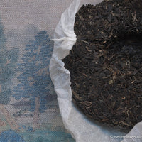 leaves detail of Pu'er shengpu Chinese tea pressed cake brick vintage and aged, 2008 spring harvest, tea forest, from Yiwu in Yunnan