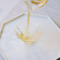 Camellia assamica flowers Daye tea, tea flower, from Yunnan China, infused in glass cup teaware in gongfucha