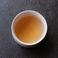 Liquor brew of Pu'er shengpu Chinese tea pressed cake brick vintage and aged, 2012 spring harvest, from Nannuo in Yunnan