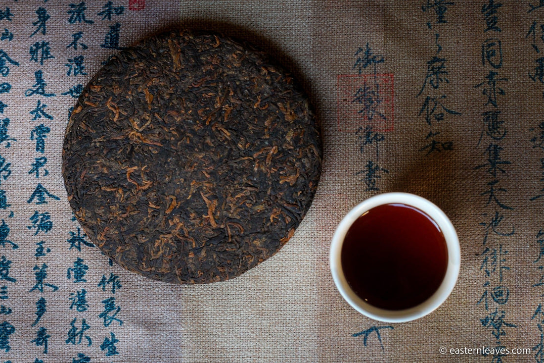 Detail of cake of pu'er shupu tea in pressed cake brick, fermented, from Yiwu mountain and ancient trees high quality tea