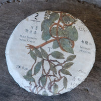 Nannuo Pu'er shengpu tea Chinese pressed cake brick vintage and aged, 2020 spring harvest, forest tea, from Yunnan