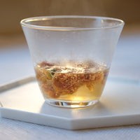 Camellia assamica flowers Daye tea, tea flower infused in glass gaiwan teapot, from Yunnan China